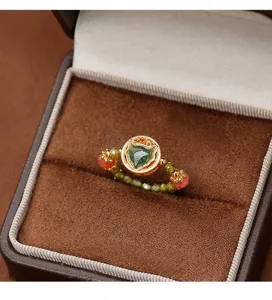 Close-up detail of a New Chinese style elastic ring featuring crystal beads and jade fox charm