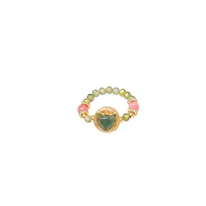 Oriental elastic beaded ring featuring green fox head charm and colorful crystals