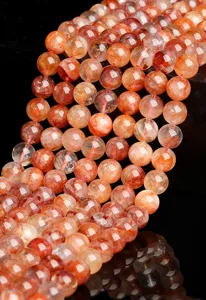 Close-up of natural red hematoid quartz beads for DIY jewelry making and accessories