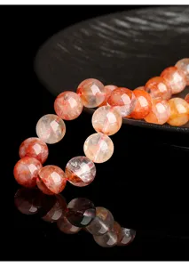 Macro detail shot of natural red phantom quartz beads with elegant clear reflection