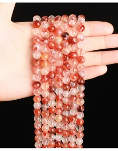 Close-up of natural red gum flower quartz loose beads for DIY jewelry making accessories