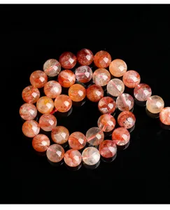 Close-up macro shot of faceted natural red hematoid quartz beads for DIY jewelry making