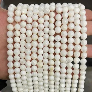 Detailed macro view of natural white freshwater shell pearl beads for handcraft jewelry