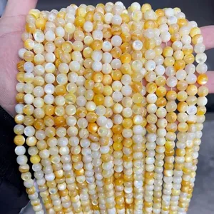 High-quality natural yellow and white freshwater shell beads for DIY jewelry making.