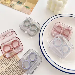 Portable contact lens case set with cute transparent box, minimalist design for travel storage.