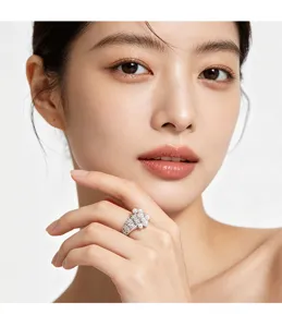 Detail shot of an elegant pearl and zircon adjustable ring on a model's finger