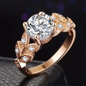 Atemberaubender Roségold Ring mit funkelndem runden Zirkonia und filigranem Blatt Design Mode.