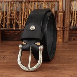 Retro embossed genuine leather belt detail shot showcasing exquisite craftsmanship and metal buckle.