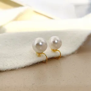 Elegant vintage white pearl clip-on earrings with minimalist gold mosquito coil design