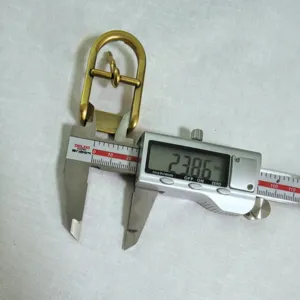 Detail view showing inner diameter measurement of gold D-ring buckle for bags and shoes accessories.