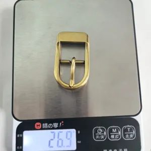 Golden metal half round pin buckle hardware accessory detail showing exact product weight.