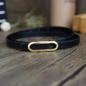 Black genuine leather thin belt for women, featuring a chic gold oval buckle for minimalist style.