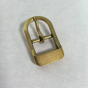 Close-up detail shot of a gold zinc alloy semi-circular pin buckle for bags and shoes accessories.
