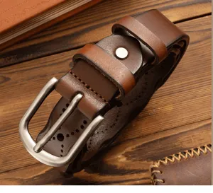 Vintage genuine leather women's belt detail showing fine stitching and metal pin buckle.
