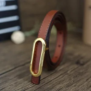 Women's slim brown leather belt with gold oval buckle, elegant vintage style for dresses.