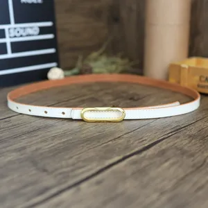 Slim white leather belt with gold oval buckle, elegant minimalist accessory for jeans.