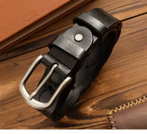 Genuine leather women's belt detail, vintage black cowhide strap with metal pin buckle.
