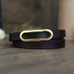 Slim genuine leather belt for women, dark brown with a gold oval buckle detail.