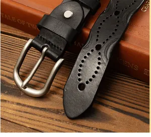 Handmade genuine leather women belt with vintage pin buckle and hollow carved pattern, retro style.
