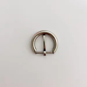 Close-up detail of the metal round pin belt buckle, showing smooth metallic finish structure.