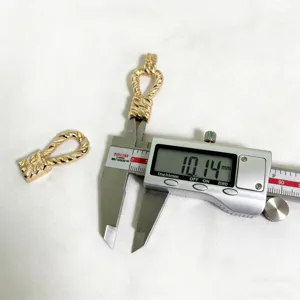 Metal alloy twisted buckle apparel accessory detail shot showing precision measurement.