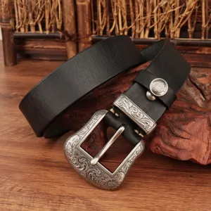 Close-up detail of the retro embossed silver metal buckle and black genuine leather belt.