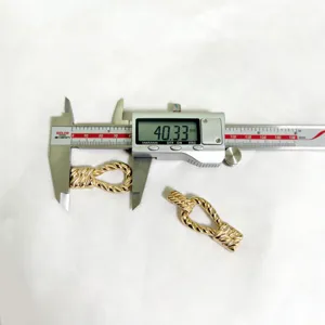Gold alloy twist rope buckle accessory, detail shot showing accurate dimensions for women clothing.