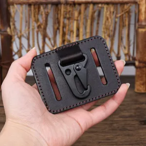 Detailed view of genuine leather belt key holder with black metal carabiner hook for men.