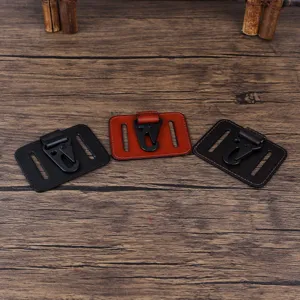 Close-up detail of genuine leather belt key clip metal hardware and stitching quality.