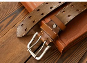 Men vintage brown leather belt with double rows of hollow holes and metal pin buckle detail.