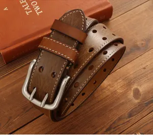 Close-up detail of retro brown leather belt featuring double pin buckle and punched holes.