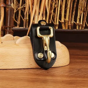 Durable black leather key holder with brass metal clip, practical belt loop key ring accessory.