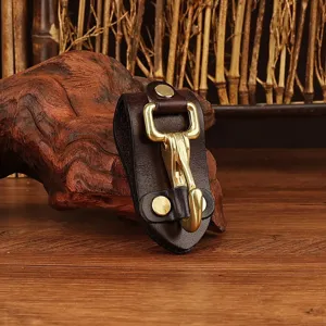 Detailed view of the premium leather belt key holder featuring a solid brass hook and metal clip.