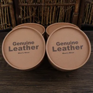 Macro view of brown kraft paper belt packaging tubes with Genuine Leather print
