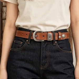 Women vintage brown leather belt with silver engraved metal buckle and western conchos.