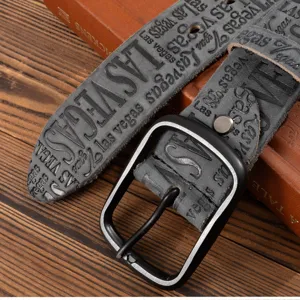 Detailed close-up shot of men's vintage grey embossed leather belt with stylish metal buckle.