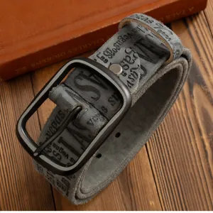 Vintage grey leather belt detailed close-up shot showcasing retro letter print and dark buckle.