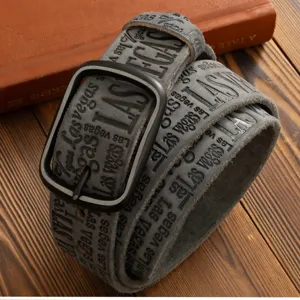 Men vintage grey leather belt with dark square buckle and embossed Las Vegas letter print details.