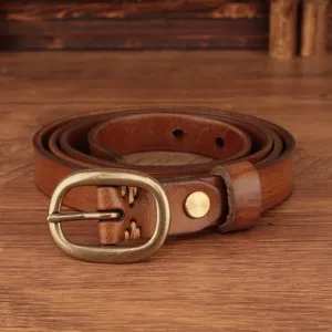 Leather belt detail showing vintage brass buckle and fine genuine cowhide texture.
