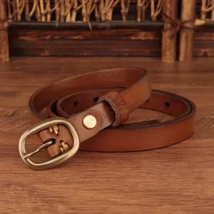 Detailed shot of brown genuine leather belt with vintage brass buckle, elegant minimalist accessory.