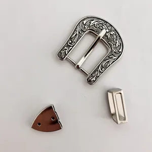 Detailed view of vintage zinc alloy belt buckle three-piece set with intricate floral carving.