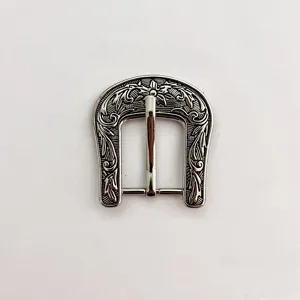 Close-up detail of vintage silver zinc alloy floral engraved belt buckle with 24mm inner diameter.