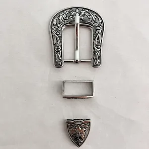 Vintage zinc alloy western belt buckle three-piece set with intricate floral carved design.