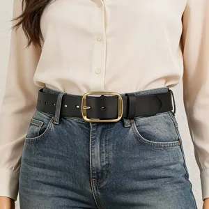 Black genuine leather belt closeup detail with retro gold-tone square pin buckle fashion.