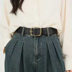 Close-up of black genuine leather belt with metallic square buckle, stylish accessory.