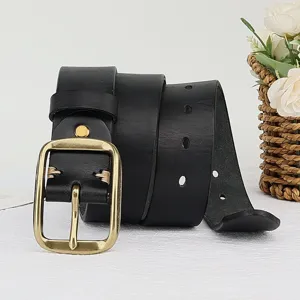 Detail shot of black leather belt with vintage metal pin buckle and exquisite hand stitching.