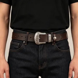 Men's retro brown leather belt with vintage engraved silver metal buckle and loop decoration.
