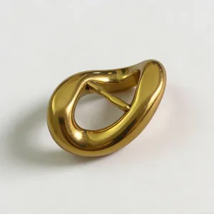 Gold irregular metal belt buckle accessory, premium zinc alloy clasp for garments.