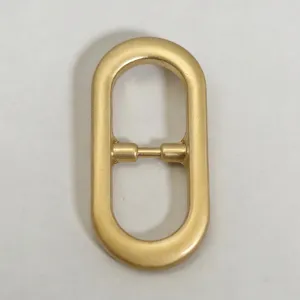 Gold oval belt buckle metal hardware replacement for women dress waist strap accessory.
