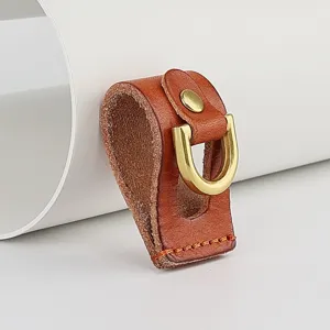 Handmade genuine leather belt loop key holder with brass D-ring clasp, detailed close-up view.
